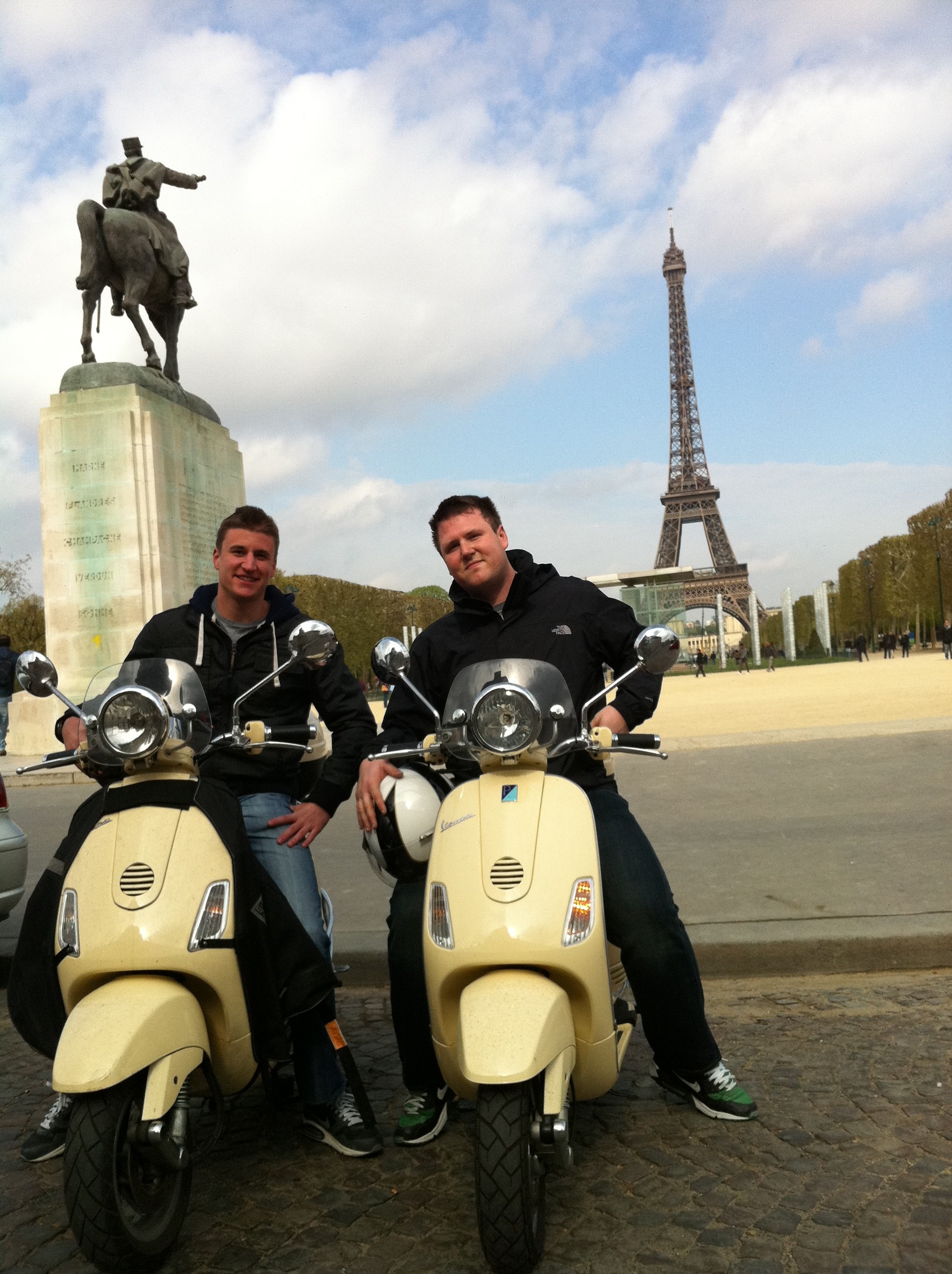 Pictures of paris france : the Eiffel Tower by Vespa scooter.